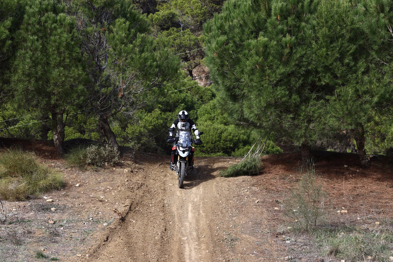 A motorcycle being ridden down a steep hill
